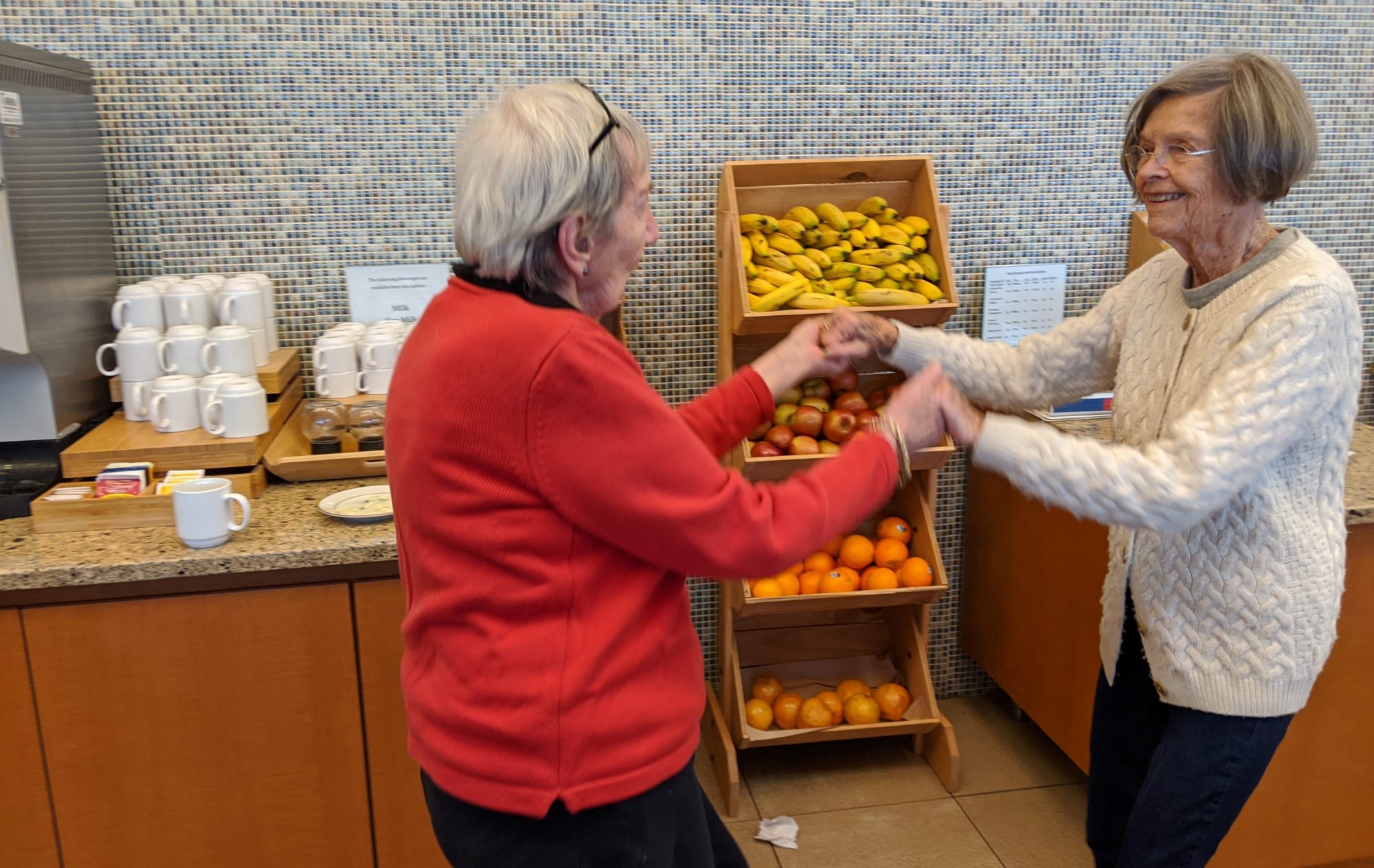Two women dancing in the Cafe